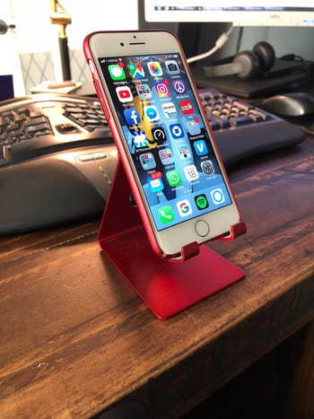 reviewer photo of iphone in red phone stand