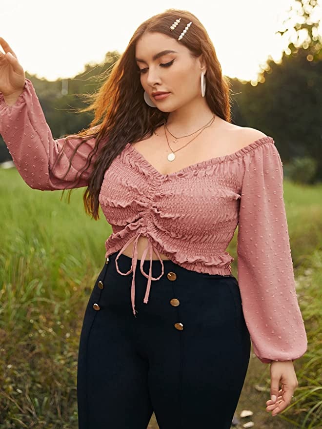 model wearing long sleeve top with a ruched detailing in the front