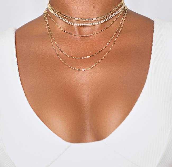 model wearing the gold necklace set