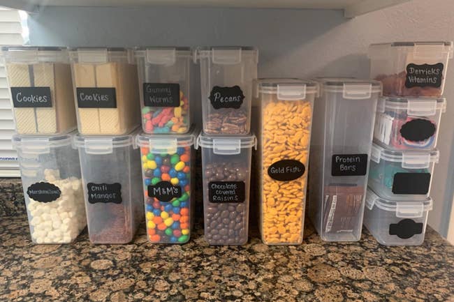 reviewer photo of airtight food storage containers on counter filled with candy and snacks