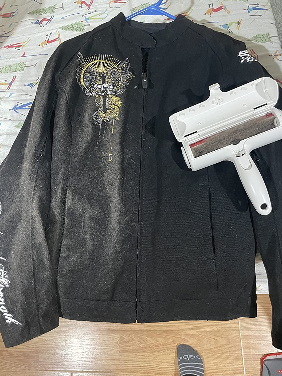 a reviewer photograph  of a the ChomChom sitting connected  a achromatic  hoodie with the near  covered successful  hairsbreadth  and the close    escaped  of hairsbreadth  