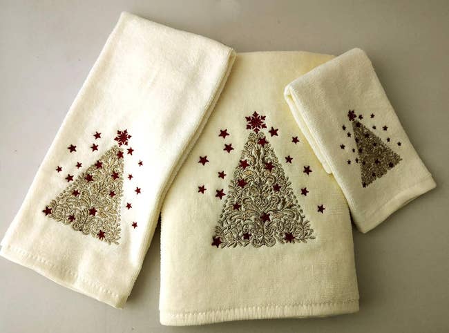 the white towels with christmas trees on them