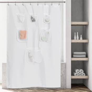 Shower curtain with built-in pockets holding various bath items