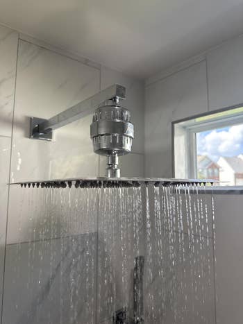 A modern rainfall showerhead with h2o filter