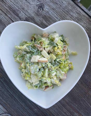 Caesar salad served in a heart-shaped bowl 