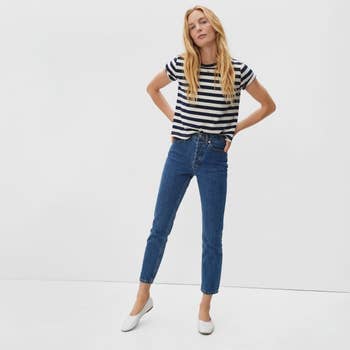 Model wearing the jeans in dark blue