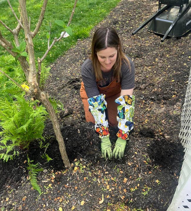person wearing gardening gloves