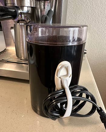 reviewer photo of the bundler being used on a kitchen appliance cord