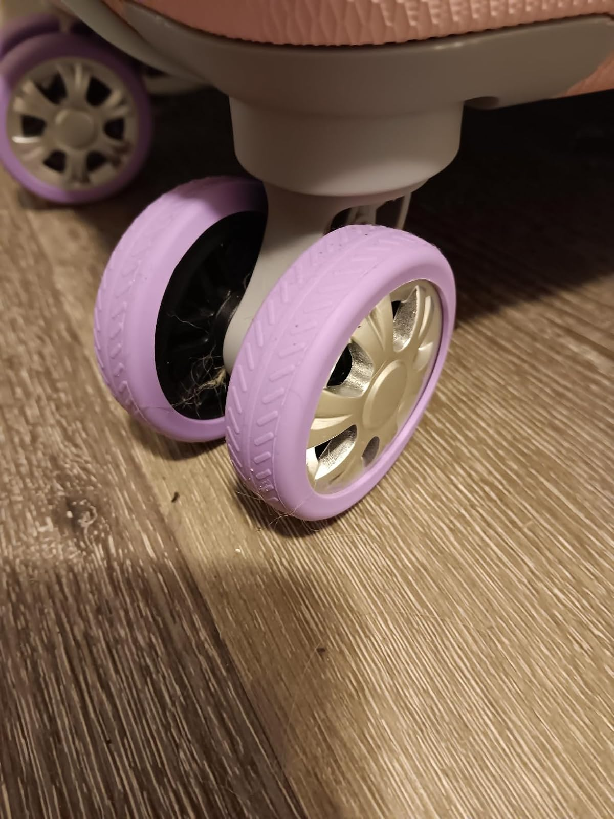 reviewer&rsquo;s close-up of suitcase wheels