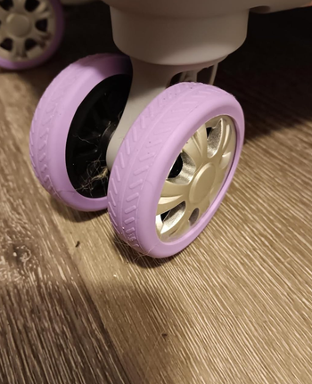 reviewer's close-up of suitcase wheels