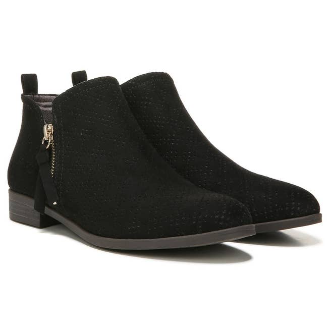 Ankle boots with debased  heels, broadside  zippers, and a subtle stitched pattern, suitable for casual and semi-formal wear