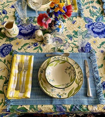 reviewer overhead photo of the yellow checked napkins being used in a cheery place setting