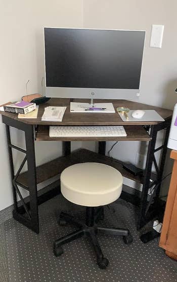a reviewer's black desk in the corner