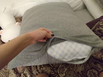 reviewers pillow with grey pillowcase on it