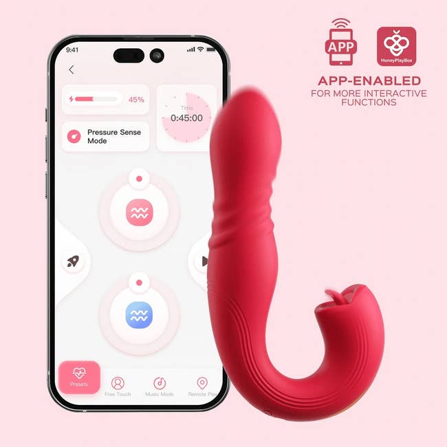 the pink thrusting G-spot vibrator and tongue clit licker next to a phone