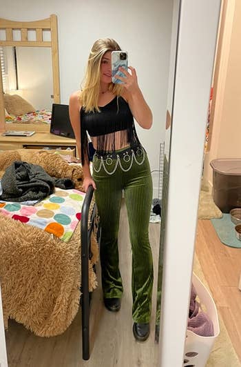 reviewer mirror selfie wearing green corduroy pants