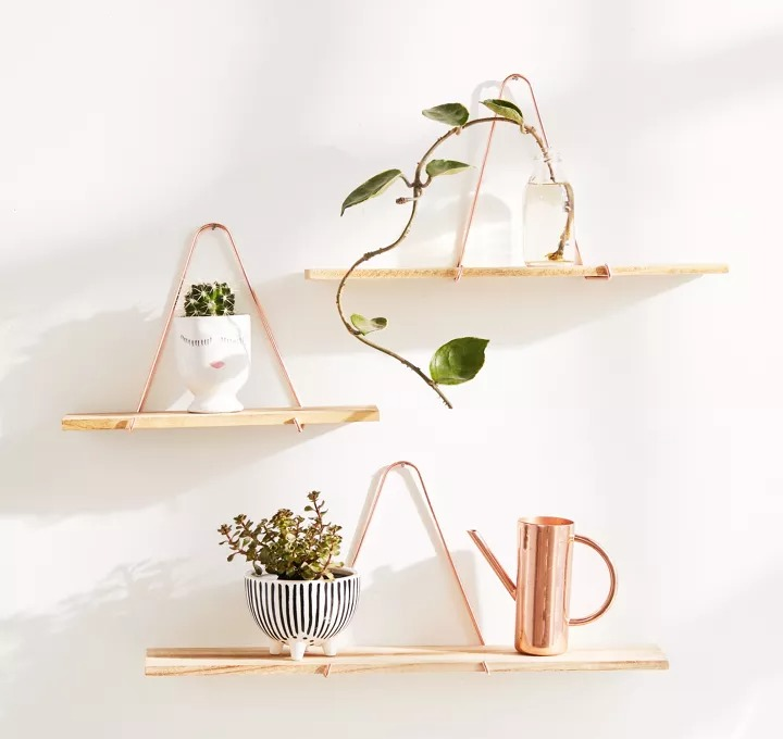 Triangle bracket wall shelves in three sizes hanging on the wall