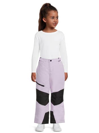 a young model wearing the lavender and black pants