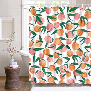 same shower curtain with a peach pattern in bathroom