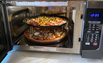 a different reviewer shows two pizza inside the microwave