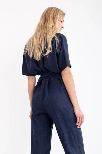 back of model wearing the navy jumpsuit