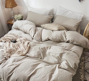 the tannish grey duvet cover on a bed