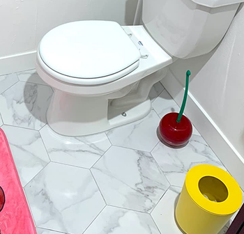 the cherry toilet brush in a reviewer's bathroom