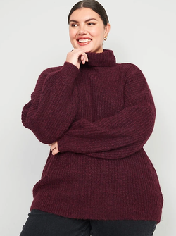 another model in a burgundy turtleneck sweater with the neck folded down