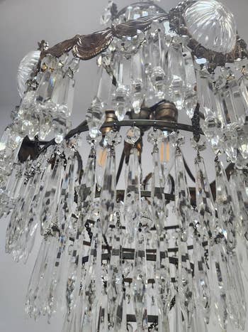 Close-up of the same chandelier now sparklingly clean