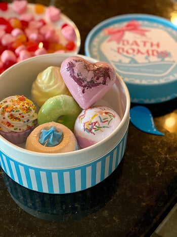 reviewer photo of a box of six colorful bath bombs