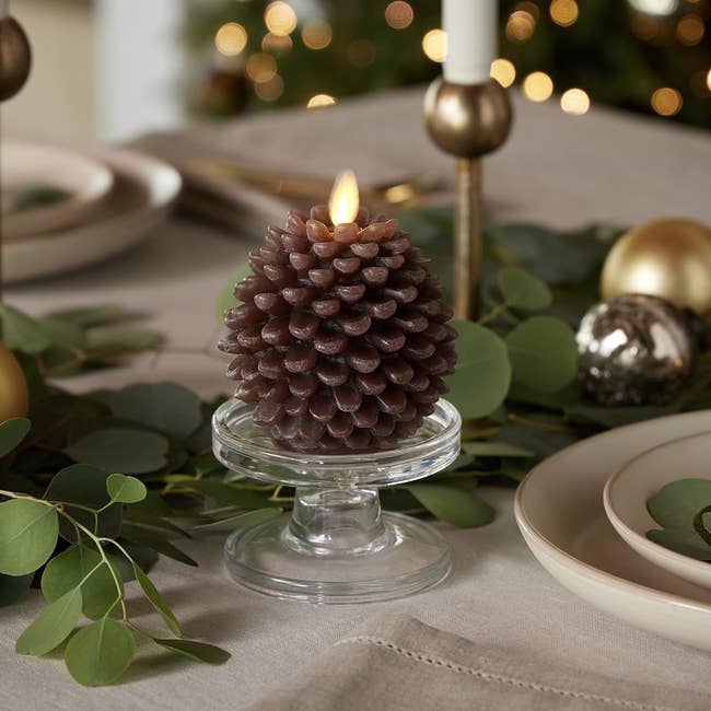 a small pinecone battery operated candle