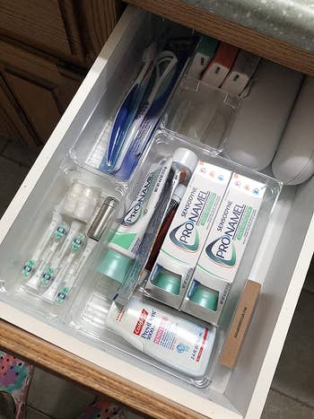 reviewer photo showing draw organizers with oral hygiene products