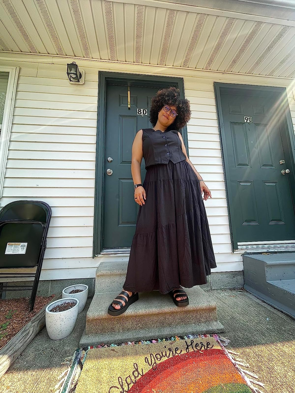 review in the black vest and long black skirt