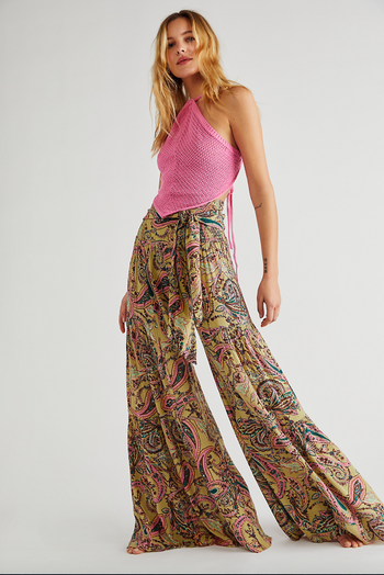 model wearing floor-length floral print palazzo pants