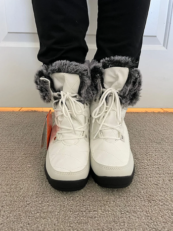reviewer wearing the boots in white