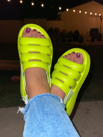 reviewer with neon green slingback ugg sandals