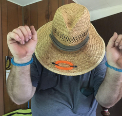 A third reviewer wearing two on their wrists and one on their hat