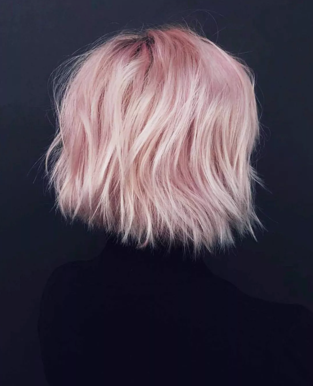 a model with short pink hair
