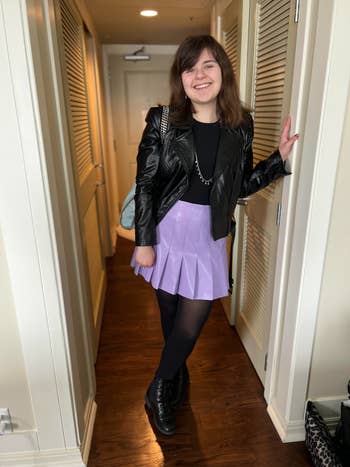me wearing the jacket over a black tee lavender skirt and black tights
