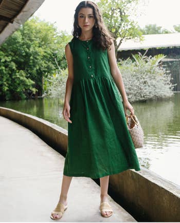 model in a sleeveless green dress