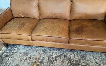 before of a stained, dehydrated leather couch