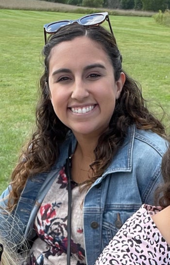 writer with defined curling hair after using the ouidad curl cream