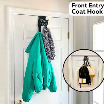 the cat hanger holding a jacket, scarf, and bags in an entryway