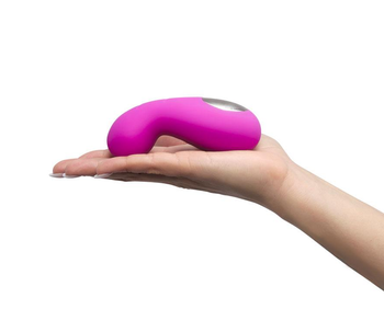Model holding vibrator flat on palm