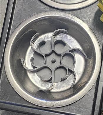 Silicone octopus-like attachment in a dog bowl 