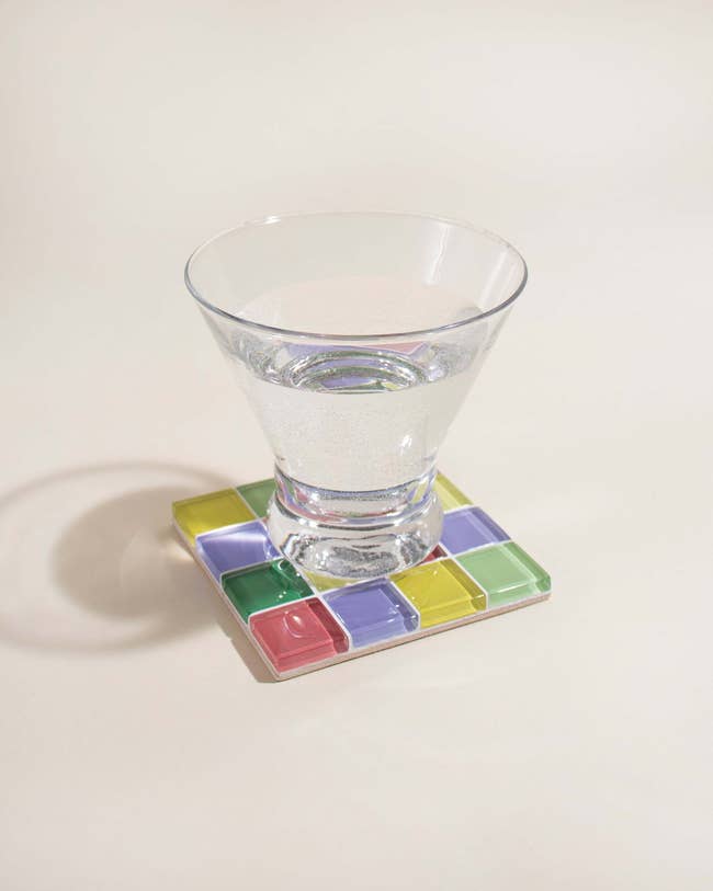 image of a glass on the colorful tiled coaster