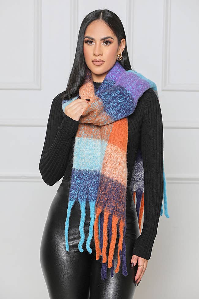model in fringed blue purple and orange checked scarf