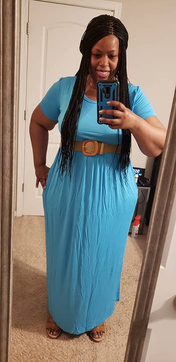 reviewer wearing solid turquoise version with a belt