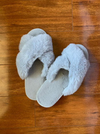 a close up image of the slippers in grey