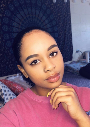 reviewer's matte, smooth looking face after using the mario badescu powder